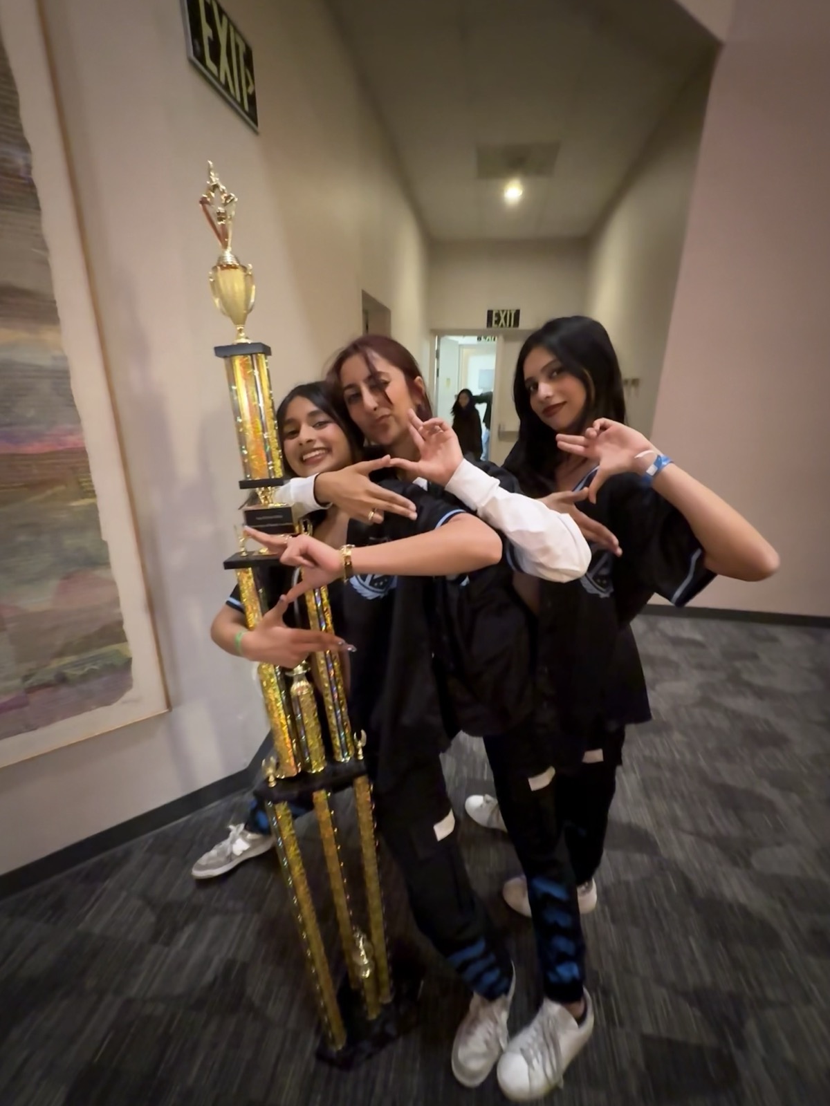 Celebrating with a competition trophy backstage